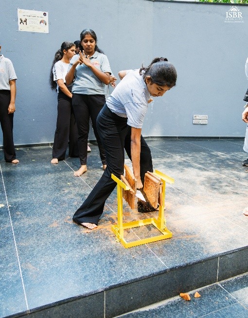 ISBR Business School students participating in a self-defense masterclass led by OSK Federation of India to promote personal safety, confidence, and leadership among young women.